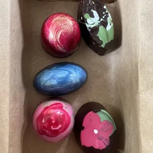 four chocolate eggs in a box