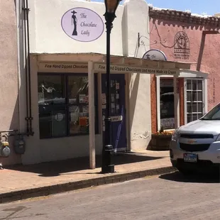 a car parked in front of a store