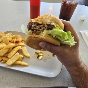 Amazing cheeseburger with steak fries.