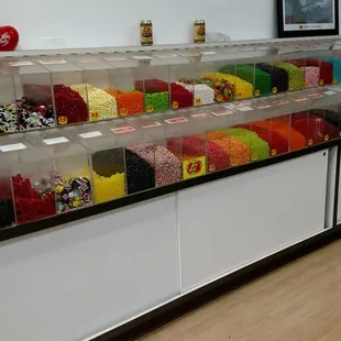 a variety of candy in a display case