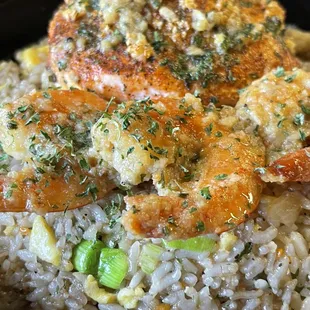 Crab stuffed salmon with simmer sautéed shrimp over garlic fried rice. www.thachoicecatering.com