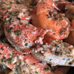 Roasted garlic crab over garlic noodles with simmer sautéed shrimp