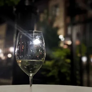 a glass of wine on a table