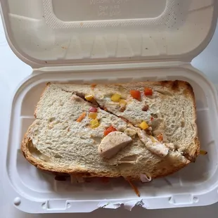 a sandwich in a styrofoam container