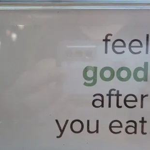 The Chopped Leaf (TCL) advertising; napkin dispenser side panel reads, &quot;feel good after you eat.&quot;