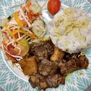 Mouth watering curry goat. Cooked with Coppin home grown spices.