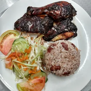 Coppin famous jerk chicken done on open flame grill with allspice wood. Smoked to perfection. Marinated in that special Coppin jerk rub.