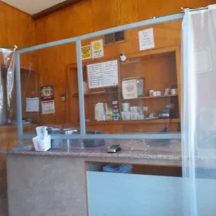 a kitchen with a counter and shelves