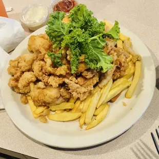 Daily special   Fried clams, grouper and shrimp. Served on a bed of fries with slaw on the side.