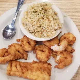 The combo. Choice of 2 meats and 2 sides. I chose the shrimp and cod with peas and rice pilaf. SOOO GOOD.