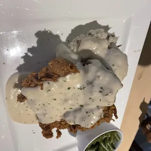 Chicken fried chicken, Mashed Red Potatoes and Green Beans with bacon pieces. Bacon not mentioned on the menu