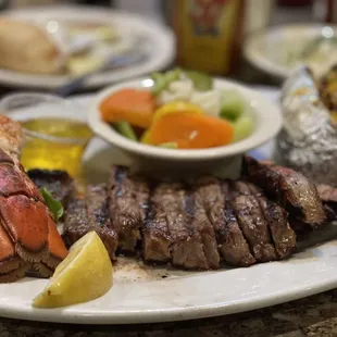 8 oz NY steak &amp; 4 oz lobster tail with a loaded baked potato and veggies on the side. Amazing!