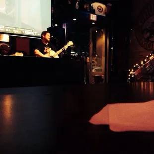 a man playing a guitar