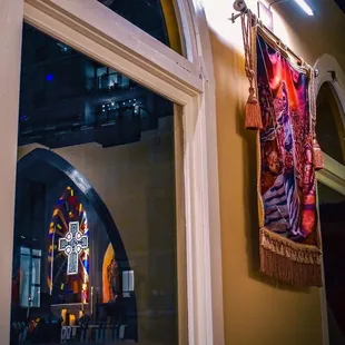 a stained glass window and a cross