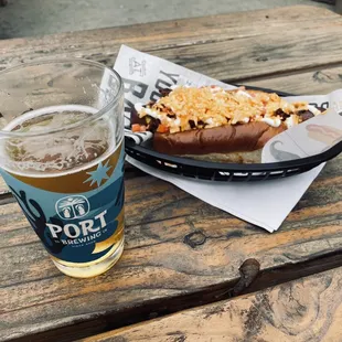 Noble experiment beer with bacon wrapped hotdog