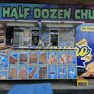 a man standing in front of a food truck