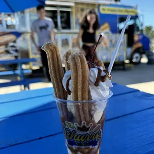 The Sugar Daddy. Churros with vanilla ice cream, caramel, chocolate syrup, whipped cream and a cherry on top.