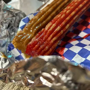 Carmel filled and strawberry filled churros