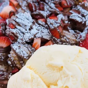 a dessert with ice cream and strawberries