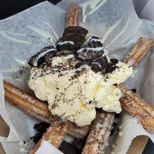 an ice cream and chocolate covered churros