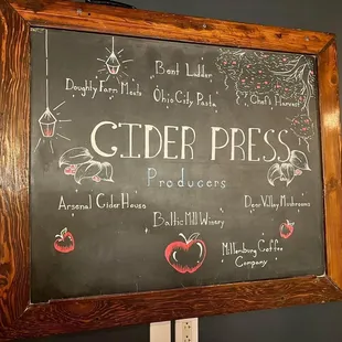 a blackboard with a list of ciders