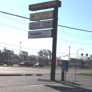 a street sign and a parking meter