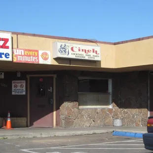 a car parked in front of a restaurant