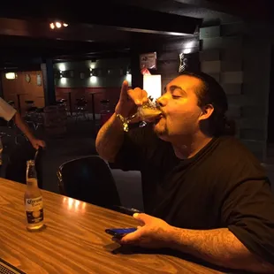 a man drinking a beer