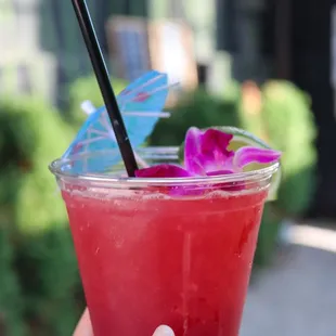 a person holding a drink