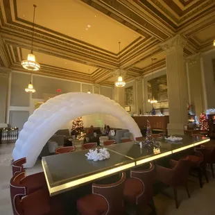 a dining room with a table and chairs