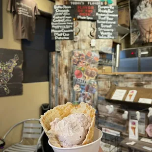 Single scoop Huckleberry Honey &amp; Lavender in a waffle cone