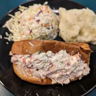 Lobster roll with Cole slaw and mashed potatoes
