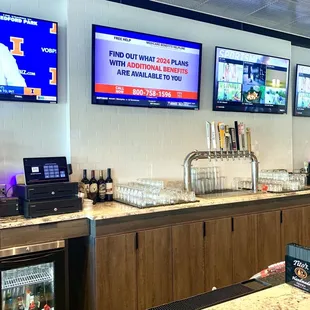 a bar with multiple televisions