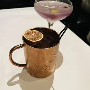 Front:  Cranberry spiced mule Back:  Royal Aviation  Both delicious