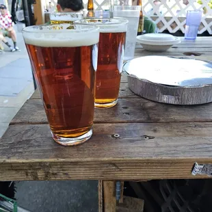 two glasses of beer on a table