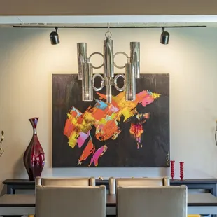 Dining room furnished with art by Brent Learned and Joy Richardson, commissioned for the space