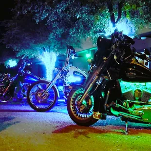 a group of motorcycles parked on the side of the road