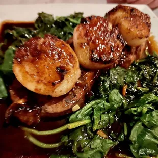 NY Strip steak and scallops over Clawson sauce with wilted spinach