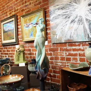 a variety of pottery items on display