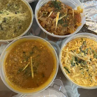 Mixed vegetarian. Top left, green curry is Palak paneer, next to right is Aloo Gobi, bottom right is Paneer bhurji, last is Tarka dhal.