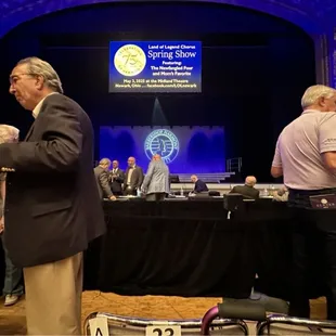 People congregate at the front of the floor as the event gets ready to kick off.