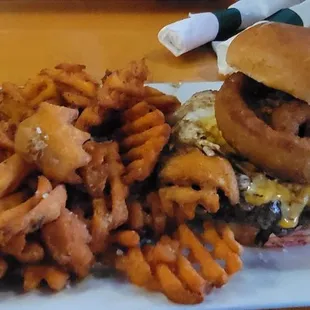 Custom cheeseburger with egg and onion ring. Sweet potato waffle fries.