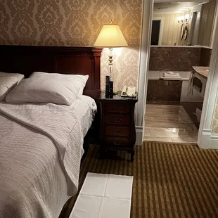 Turndown service including chocolates, The Cliff House Newsletter with a bit of history and weather, and a bedside welcome mat.