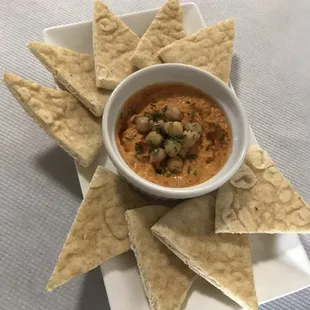 Roasted red pepper hummus served with warm pitas