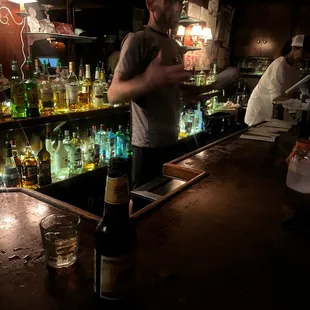 a man standing at a bar