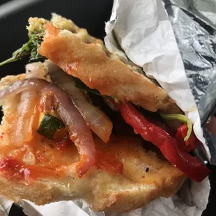 a sandwich wrapped in tin foil