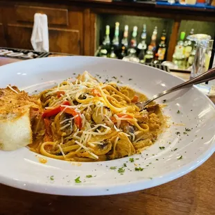 a plate of pasta and bread