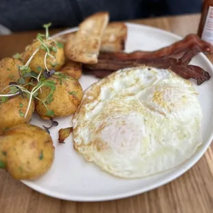 Egg breakfast. Comes with sourdough toast, applewood smoked bacon, and potatoes.