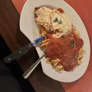 a plate of spaghetti and meat