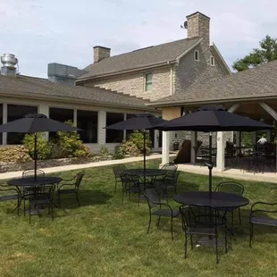 Exterior seating and greenspace is available poolside.